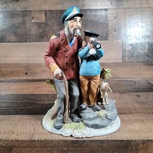 Nautical Statue of Sailor, Boy, and Dog, looking out to sea
